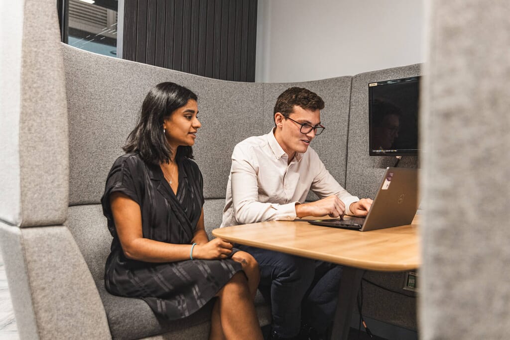 two people working in an office collaboratively
