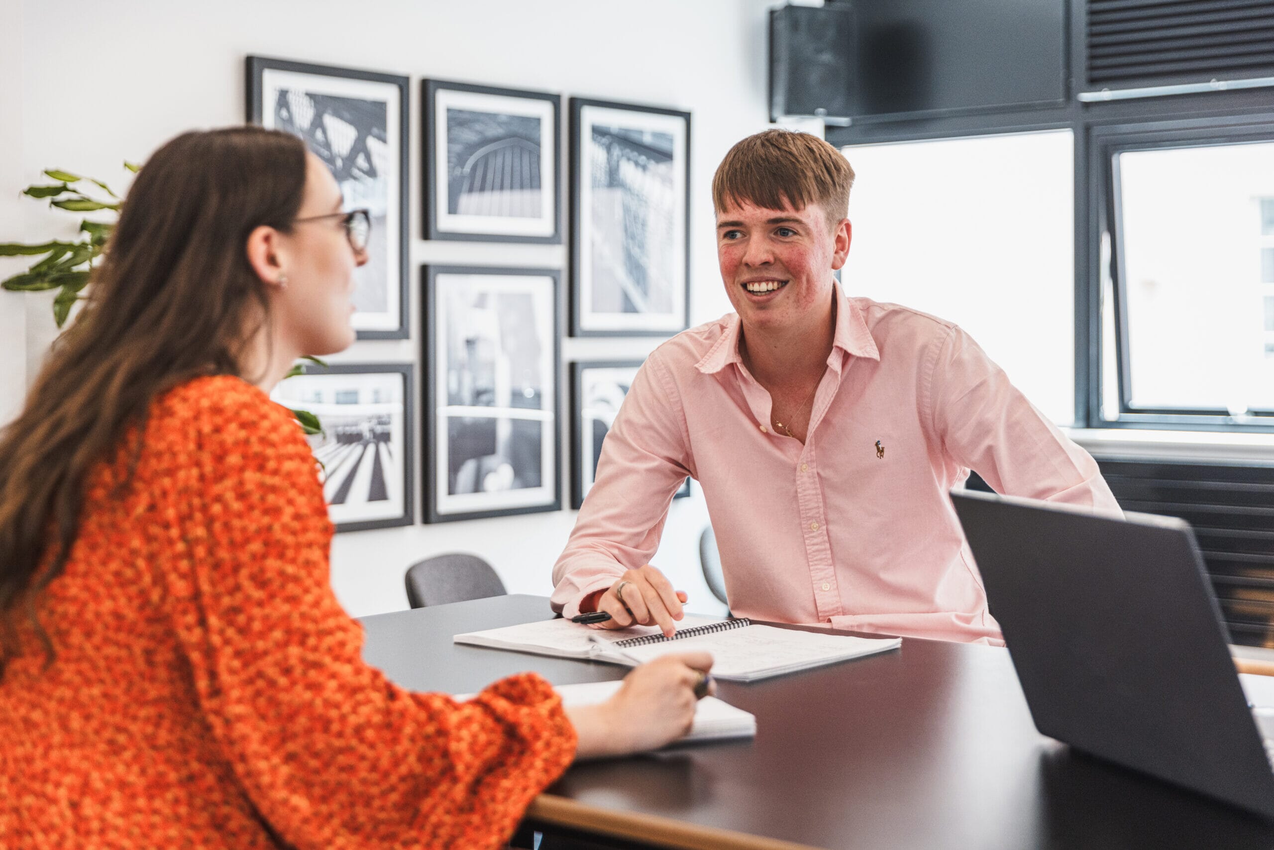 Two people discussing work int he office